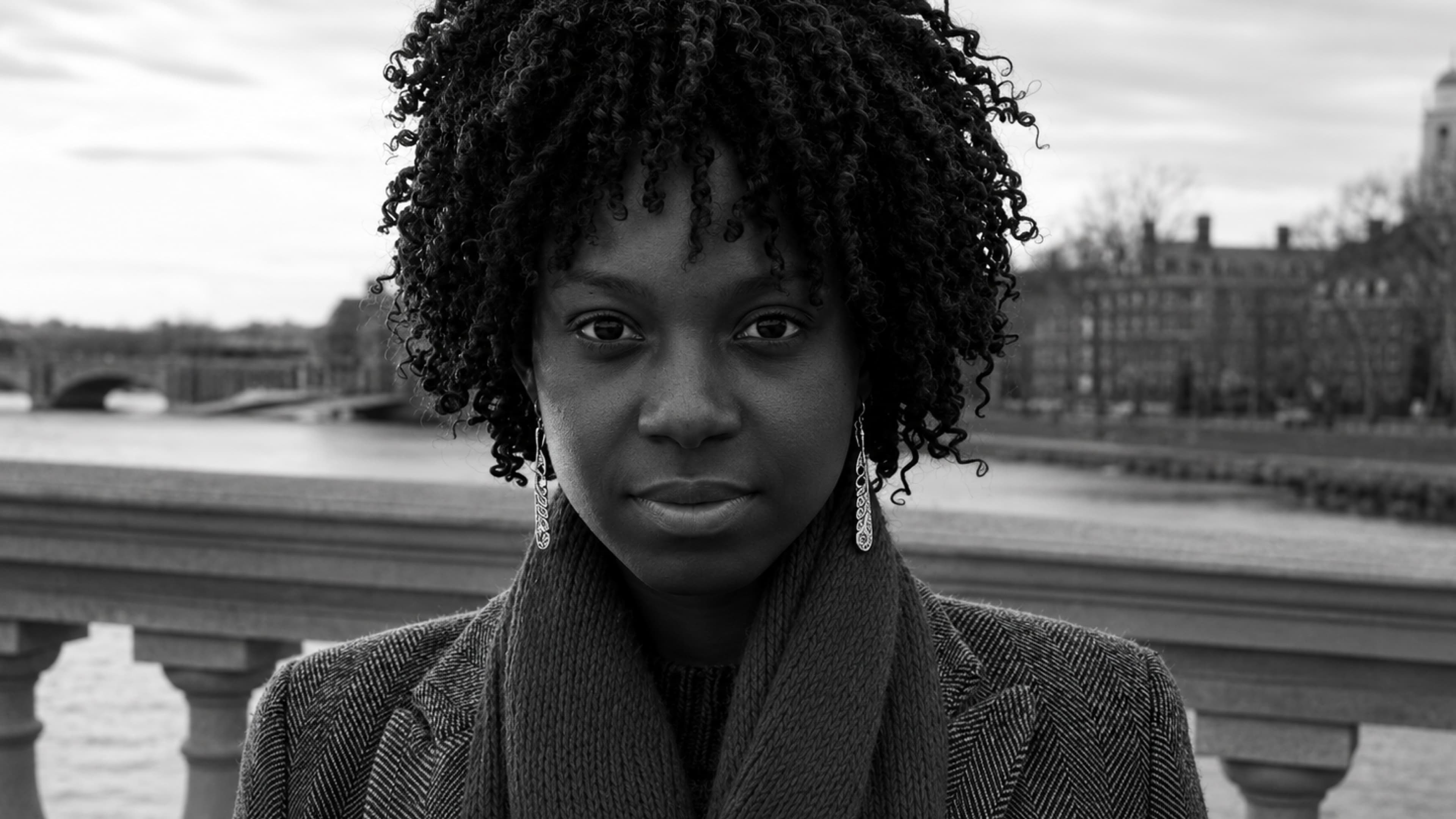 Portrait by the Charles River with the Harvard campus behind