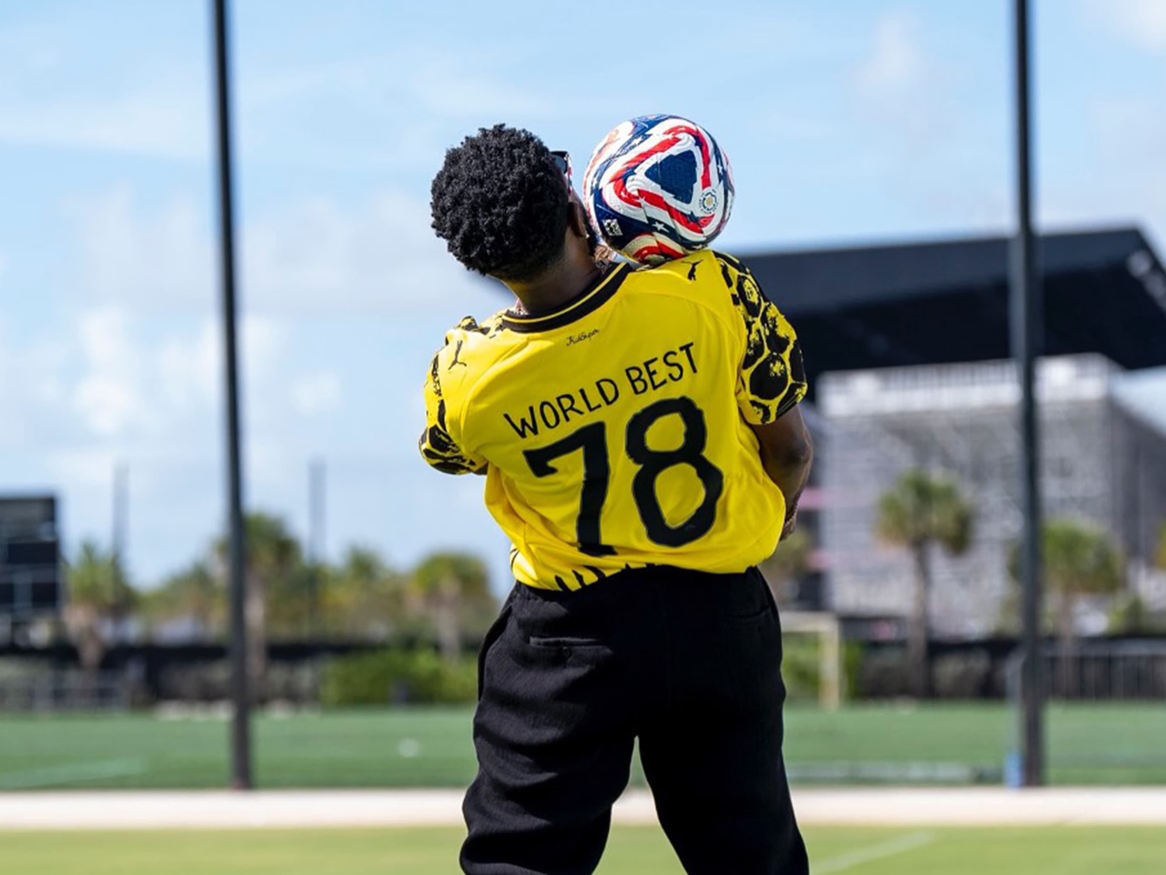 Juggling a football in a Borussia Dortmund jersey at the club's training ground